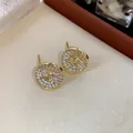 Elegant gold-plated stud earrings featuring a sparkling pave CZ 'H' logo design for women - 19 Silver Needles - Gold