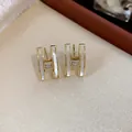 Exquisite gold plated H-shaped stud earrings featuring white shell inlay and sparkling zircons - 17 Silver Needles - Gold
