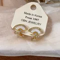 Elegant fan-shaped gold-plated stud earrings with crystals and white shell inlay - 1 Ear Clip - Gold
