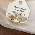 Elegant gold-plated bow-shaped stud earrings featuring zircon and pearl accents for women - 5 Ear Clips - Gold