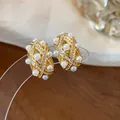 Elegant gold plated stud earrings featuring geometric lattice, pearls and zircons. - 10 Ear Clips - Gold