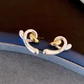 Two-tone knot stud earrings in silver and gold finish for an elegant jewelry style. - 40 Silver Needles - Gold - Silver