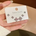Σετ έξι κομψά ροζ κρυστάλλινα σκουλαρίκια σε λουλουδάτα και γεωμετρικά σχήματα - Στυλ 27 Σετ Τριών Ζευγαριών Τριφύλλι με Στρας (Ασημένιο Στέλεχος) / Ασημί-Ροζ