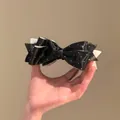Elegant black fabric bow hair clip featuring white polka dots for a stylish hair look - 40# Twist Clip - Black