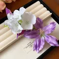 Elegant purple and white fabric floral hair clip accessory shown on a cream display - 52# Duckbill Clip - White - Purple