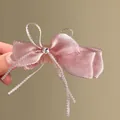 Elegant dusky pink satin bow hair claw clip featuring a delicate star center detail - 61# Twist Clip - Pink