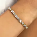 Elegant tennis bracelet featuring alternating rectangular and round crystals with gold finish - Clear (WG-0981)