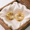 Elegant chunky gold-plated stainless steel hoop earrings with unique textured finish - Hammered Loop Earrings