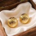 Elegant gold plated hammered sphere stud earrings presented in a wooden gift box - Gold Bean Stud Earrings