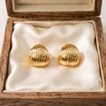 Elegant gold-plated stainless steel dome stud earrings with vertical textured ridges - Brushed Wave Stud Earrings