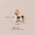 Hand-painted white ceramic horse pendant with red floral pattern and gold-tone metal loop - No. 8 Patterned Horse Pendant