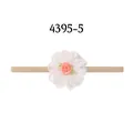 Exquisite infant nylon headband featuring a layered white fabric flower with a pink rose center - Lace Decor with Pink Flowers (5-5)