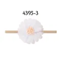 Elastic tan nylon baby headband featuring a delicate white mesh daisy flower with peach center - White Daisy (5-3)
