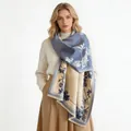 Elegant cashmere-like shawl with blue and beige magnolia flower patterns worn by a model - 185 cm / Fresh Floral-Blue