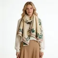 Detailed view of cream cashmere-like scarf with green magnolia print on female model - Fresh Floral-Khaki Green / 185cm