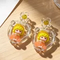 Cute cartoon girl dangle earrings with yellow hair and transparent floral details - Orange Yellow Cartoon Doll Beaded Earrings (2607198)