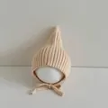 Minimalist beige ribbed knit baby pixie bonnet hat with comfortable adjustable chin ties - Elf Hat Beige