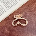 Elegant gold heart-shaped claw clip with rhinestones on a wood background - Dual Heart Style (18-25) / 4.50cm / Gold