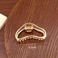 Elegant 6.5cm golden metal shark hair claw clip accessory for women's daily hairstyling - Irregular Style (18-40) / 6.50cm / Gold