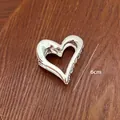Polished silver heart-shaped metal hair claw clip for women shown with 6cm size indicator - Silver Heart Style (18-40) / 6cm / Silver