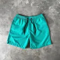 Men's lightweight quick-dry swim trunks in vibrant teal color with adjustable drawstring waist - M / Bottoms / Mint Green