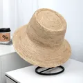 High-quality hand-woven raffia straw bucket hat for sun protection on a minimalist stand - One Size(Adjustable) / Plain Wide Brim Style (LF1048)