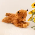Lifelike Scottish Highland cow plush toy with fluffy ginger fur in a lying down pose - Lying Down / 36cm / Brown