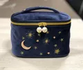 Detailed view of the velvet makeup bag with gold moon and star embroidery - Square Handle Style / Blue