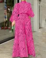 Vista a figura intera di una tuta fucsia con stampe grafiche a linee nere astratte. - Taglia S / Maniche Lunghe Rosso Rosa