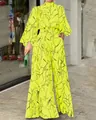 Elegante tuta giallo neon a gamba larga con stampa astratta viso e maniche lunghe - Taglia S / Giallo A Maniche Lunghe