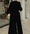 Elegante tuta nera a maniche lunghe con stampa astratta e gambe larghe - Taglia S / Maniche Lunghe Tinta Unita Nera