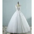 Elegant white V-neck wedding dress featuring intricate lace and full tulle ballgown skirt. - White / S