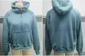 Vue de face et de dos d'un sweat à capuche bleu sarcelle à demi-zip pour femme - S / Hauts / Bleu Cyan