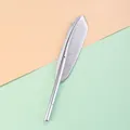Detailed view of the intricate metallic silver feather design on this vintage gel pen. - Feather Shape (Silver) / 0.5mm Needle Tip
