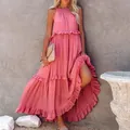 Detail showing a dusty pink tiered maxi dress with ruffles and floor-length hem. - S / Tops / Pink