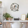 Decorative circular metal wall art featuring two birds on branches for home office decor - Bird 2