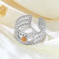 Elegant silver stainless steel open ring featuring a unique orange evil eye bead design - Eye Shape Orange (GJ086)