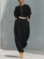 Completo due pezzi nero da donna con top a maniche lunghe e pantaloni a zampa. - Taglia S / Top E Pantaloni / Nero