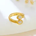 Elegant gold stainless steel open ring with white oval accents and ribbed band texture - Double Head Oval Spiral (GJ101)