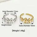 Stainless steel open ring featuring a family motif available in silver and gold finishes - Hand-in-hand People Style / Steel