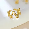 Elegant gold irregular wavy stainless steel open ring with embedded white pearls - Wave Pearl Embellishment (GJ106)