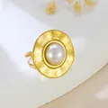 Elegant gold plated stainless steel irregular hammered open ring featuring a large white pearl - Hammered Texture Pearl (GJ111)
