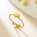 Elegant gold stainless steel heart ring with a unique twisted band design in SKU view. - 3D Texture Heart (GJ114)
