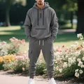 Outdoor full shot of men's grey heavy fleece hoodie and multi-pocket cargo jogger set - Dark Gray