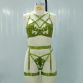 Green embroidered mesh lingerie set with garter belt shown on a display mannequin - Green
