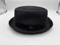 Elegant black straw yarn pork pie jazz hat with decorative ribbon and metal emblem - Embossed Black / 57cm