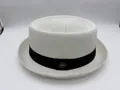 Classic white breathable straw jazz hat featuring a black ribbon and gold emblem detail - Textured White / 57cm