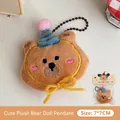Adorable brown plush bear keychain pendant featuring blue party hat and yellow bow charm - Smiling Hat Bear Plush Pendant