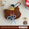 Adorable brown plush bear keychain featuring a party hat and a blue bow accessory. - Cute Brown Bear Plush Toy Pendant