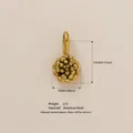 Golden flower pendant in stainless steel showing 12mm size and weight details - October Flower Pendant